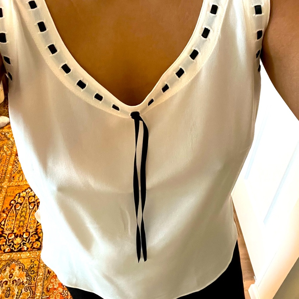 Escada cami. Size 42 but can fit many shapes and sizes due to it’s cut.